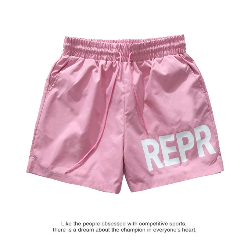Represent Large Logo Nylon Shorts - Pink