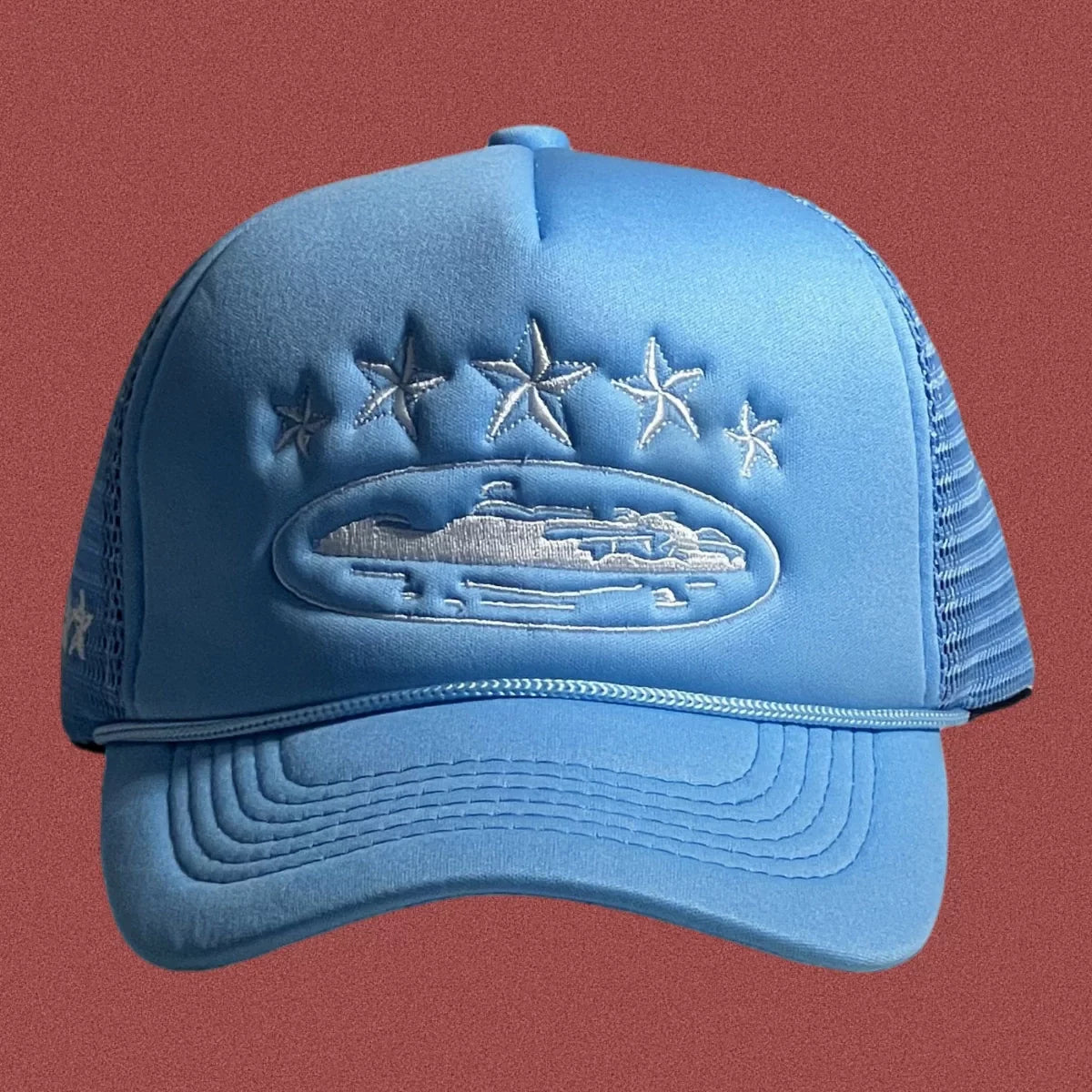 Corteiz Vintage Light Blue Trucker Hat with White Stars and Cruise Ship Graphic